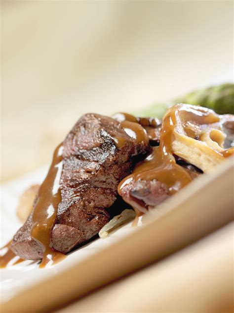 swiss-venison-steak-crock-pot-recipe-the-spruce-eats image