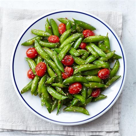 snap-pea-cherry-tomato-stir-fry-recipe-eatingwell image