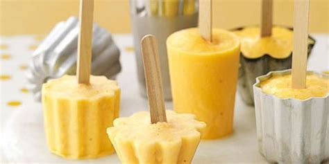 orange-banana-smoothie-pops-recipe-country-living image