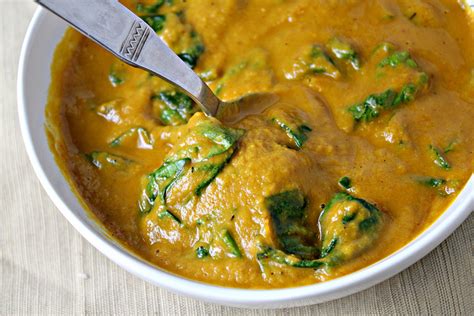 nutty-sweet-potato-soup-with-harissa-and-spinach image