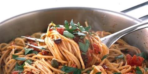 pasta-with-anchovies-tomatoes-olives-and-garlic-good image