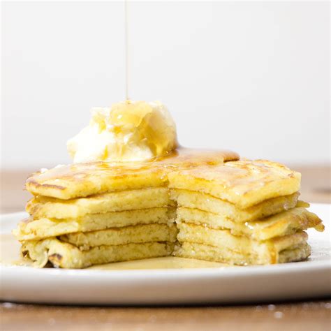 buttermilk-pancakes-with-maple-syrup-and-whipped image