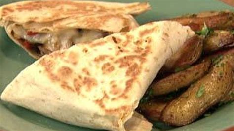 cheesesteak-chimichangas-recipe-rachael-ray-show image