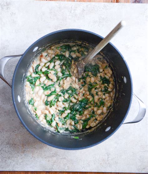 creamy-parmesan-white-bean-stew-with-spicy-greens image