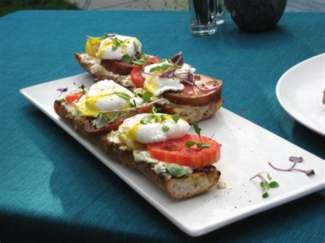 poached-eggs-on-toasted-baguette-with-goat-cheese image