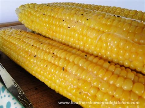 easy-oven-roasted-corn-with-husks-heathers image