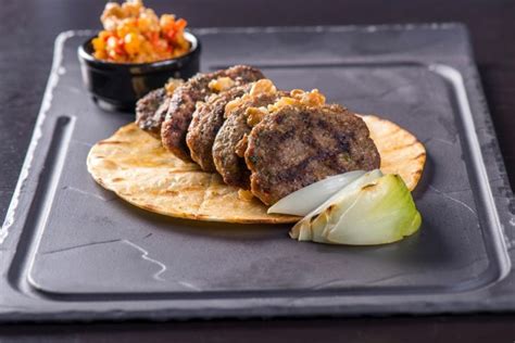 turkish-style-lamb-burgers-with-walnut-sauce image