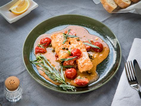 poached-cod-in-tomato-sauce-recipe-kitchen-stories image