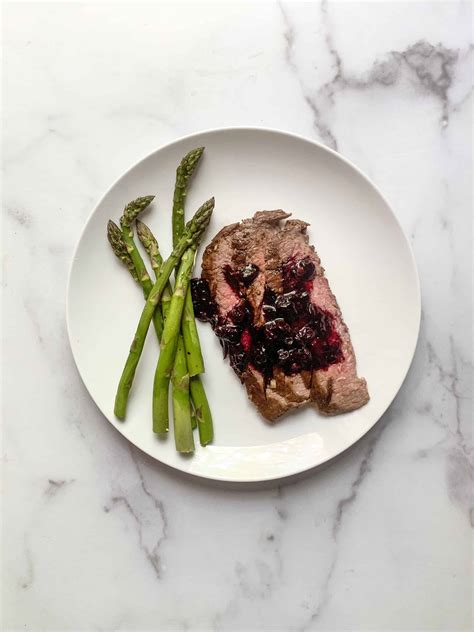 flank-steak-with-blueberry-balsamic-sauce-worn-slap-out image