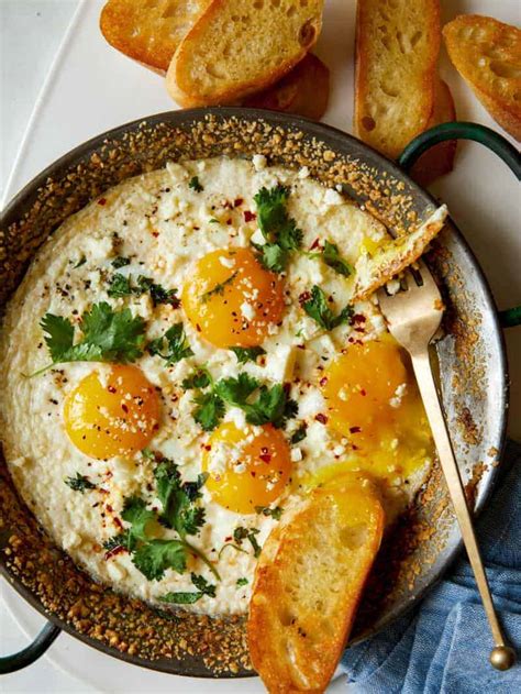 simple-herb-baked-eggs-with-crumbled-cheese image