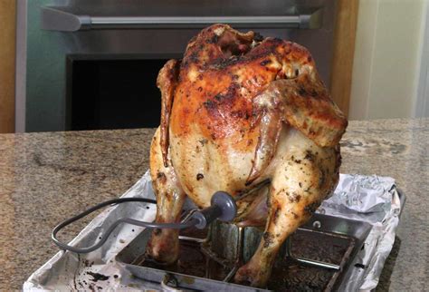 vertical-beer-can-roasted-chicken-recipe-the-spruce image