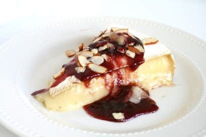 baked-brie-with-cranraspberry-sauce-and-toasted image