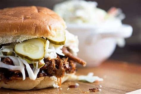 barbecue-pulled-pork-sandwiches-with-pickle-slaw image