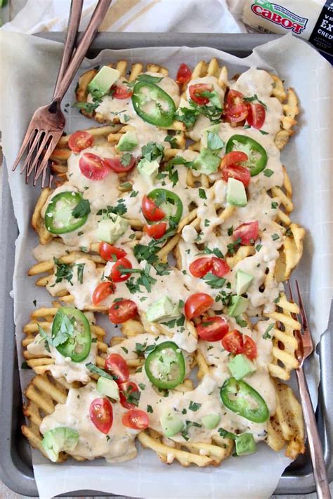 waffle-fry-nachos-with-green-chili-cheese-sauce image