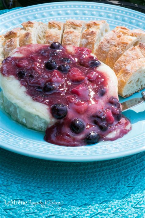 baked-brie-with-fresh-peach-and-blueberry-compote image