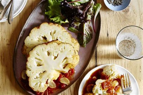 whole-pot-roasted-cauliflower-with-tomatoes-and image