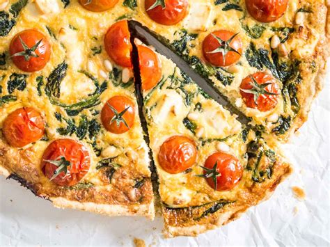 spinach-quiche-with-tomatoes-and-cheese-plated image