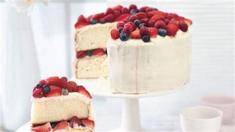 orange-layer-cake-with-buttercream-frosting-and-berries image