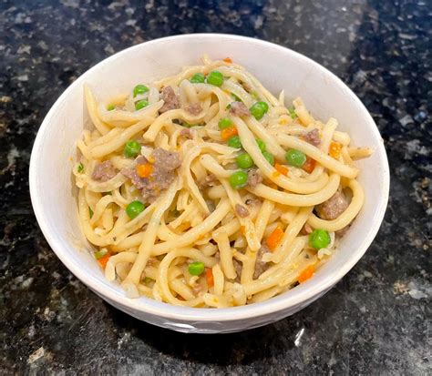 spring-pasta-bolognese-with-lamb-and-peas image