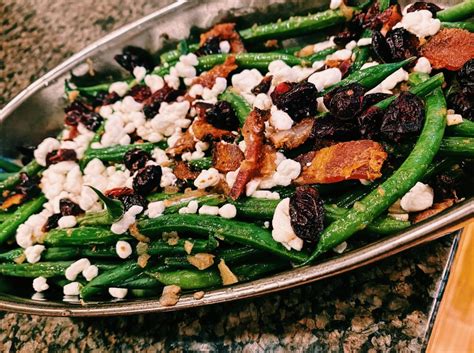 green-beans-with-goat-cheese-and-warm-bacon-dressing image