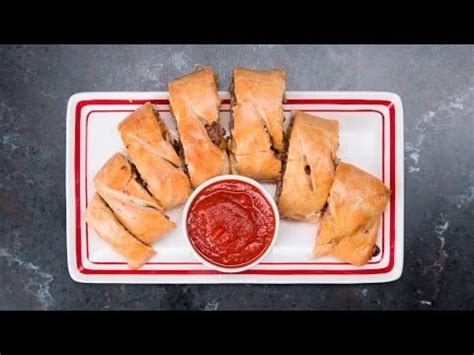 how-to-make-sausage-onion-peppers-pizza-roll image