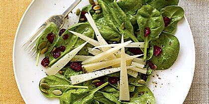 spinach-salad-with-cranberries-pumpkin-seeds image