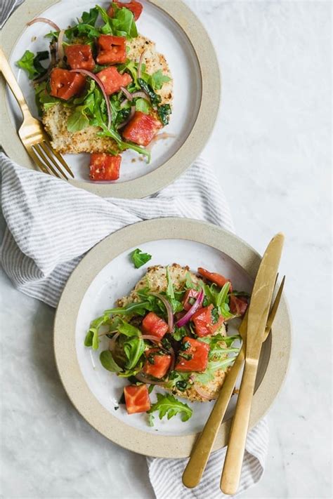 baked-chicken-milanese-with-arugula-and-tomatoes image