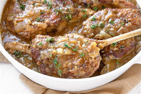 smothered-pork-chops-in-a-savory-pan-sauce-the image