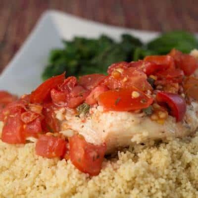 rockfish-with-tomatoes-and-herbs-baked-in-a-foil-packet image