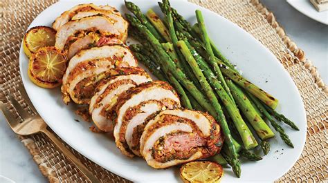 grilled-lemon-parsley-stuffed-turkey-breast-asparagus image