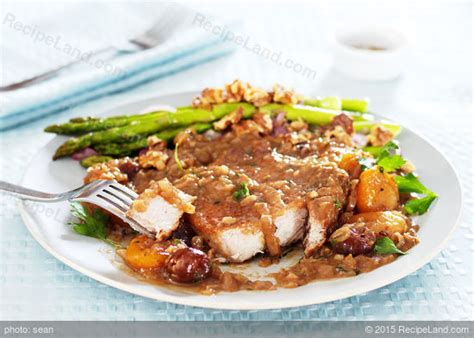 braised-pork-chops-with-prunes-and-apricots image
