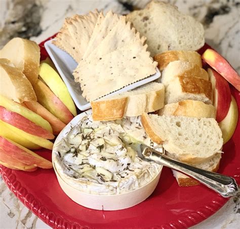 baked-brie-with-garlic-the-art-of-food-and-wine image