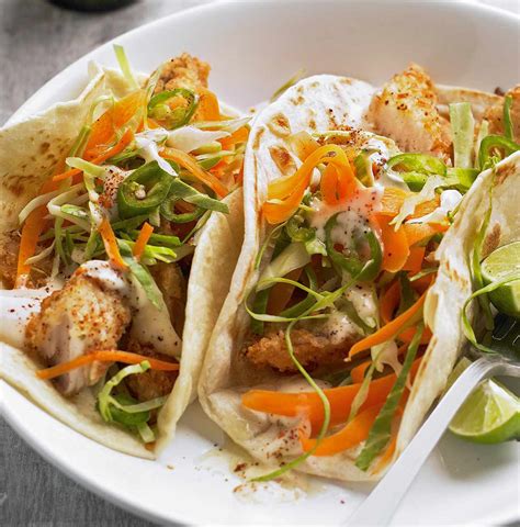 fish-tacos-with-lime-sauce-better-homes-gardens image