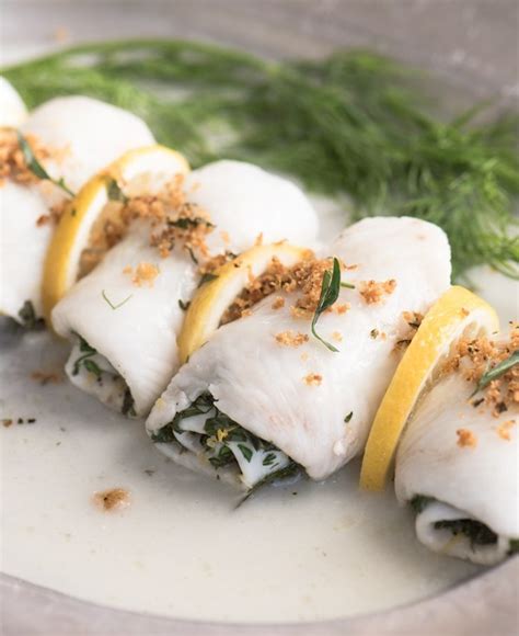 oven-poached-sole-wrapped-in-fresh-herbs-lemon image