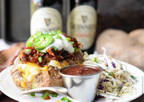pulled-pork-loaded-baked-potatoes-recipe-butter-your-biscuit image