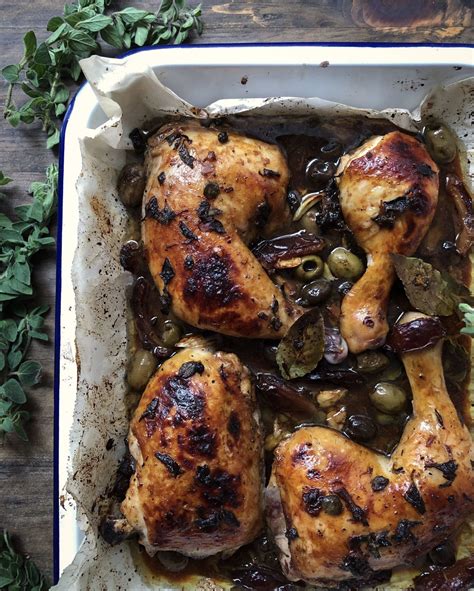 roast-chicken-with-garlic-olives-dates-and-oregano image