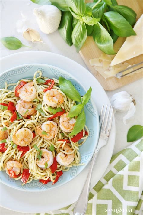 pesto-pasta-with-grilled-shrimp-and-roasted-red-peppers image