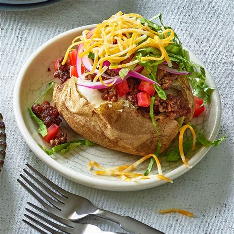 cheeseburger-stuffed-baked-potatoes-recipe-eatingwell image