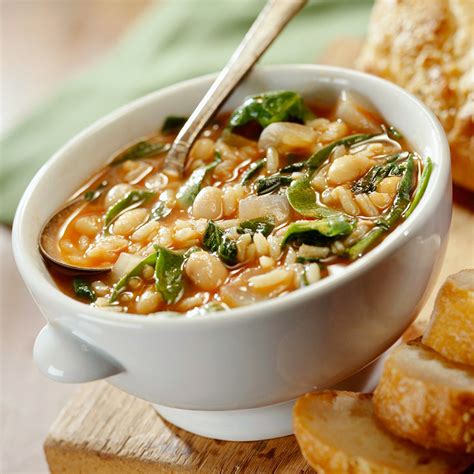 savory-bean-spinach-soup-recipe-eatingwell image