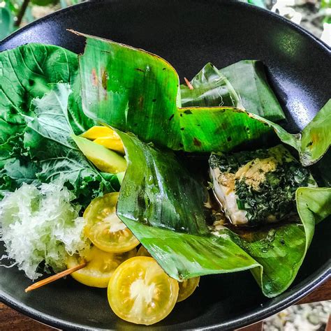 delicious-healthy-steamed-fish-in-banana-leaf image
