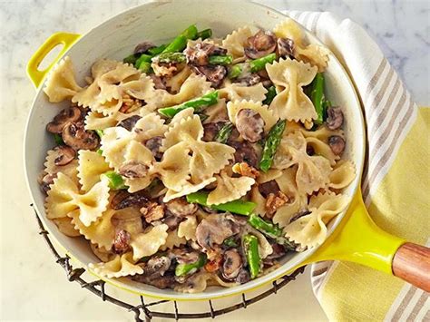 creamy-farfalle-with-cremini-asparagus-and-walnuts image