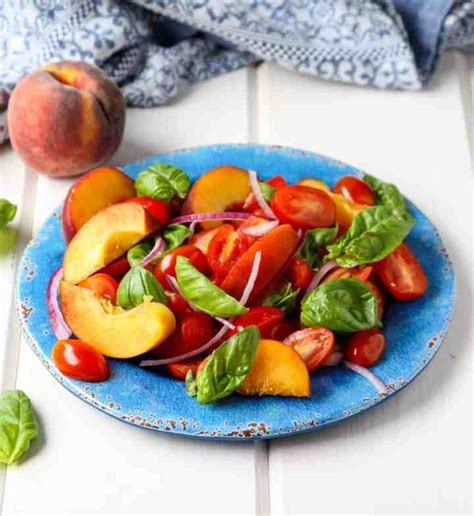 tomato-peach-salad-with-basil-red-onion-the-food image
