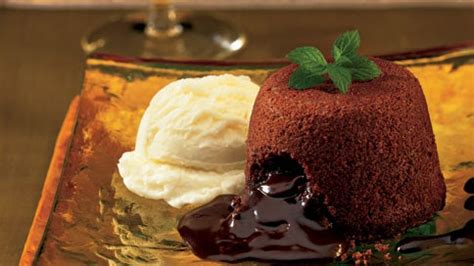 molten-chocolate-cakes-with-mint-fudge-sauce image