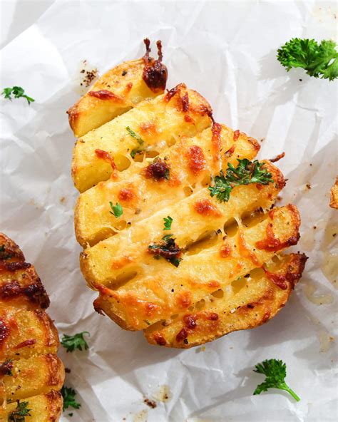 easy-cheesy-scored-baked-potatoes-xoso-vegetarian image