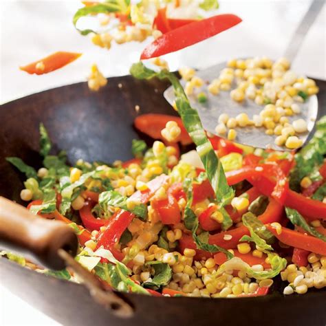 stir-fried-carrots-corn-peppers-eatingwell image