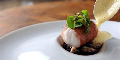 sous-vide-monkfish-wrapped-in-parma-ham-with-cockles image