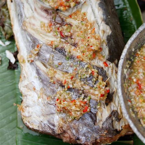 fish-grilled-in-banana-leaves-with-chile-lime-sauce image