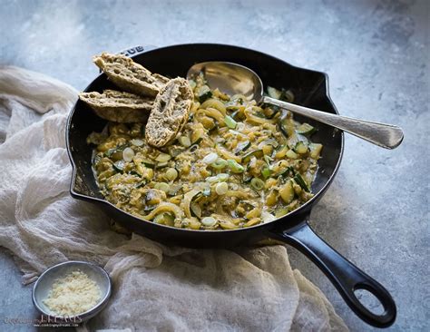 scrambled-eggs-with-zucchini-and-onions-cooking image