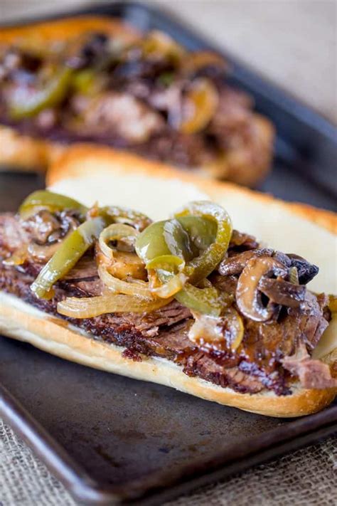 slow-cooker-philly-cheese-steak-sandwiches-dinner image