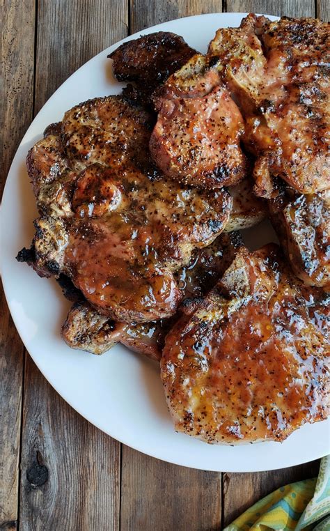 juicy-grilled-pork-chops-with-spicy-peach-glaze image